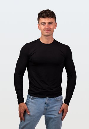 - Bluzka z długim rękawem