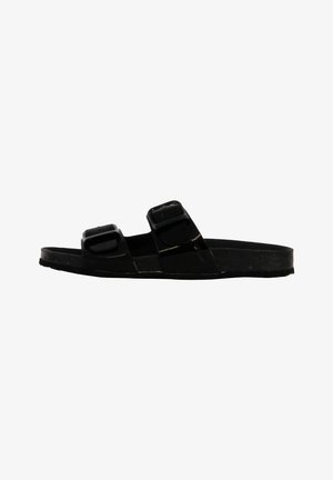 Chanclas negras con dos correas ajustables, suela plana, acabado mate y material de goma para mayor durabilidad y comodidad.