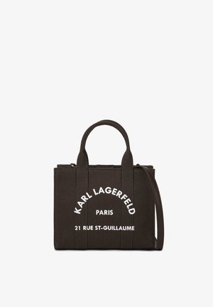Black Karl Lagerfeld tote bag with short handles, a shoulder strap, and white Paris address text on front.