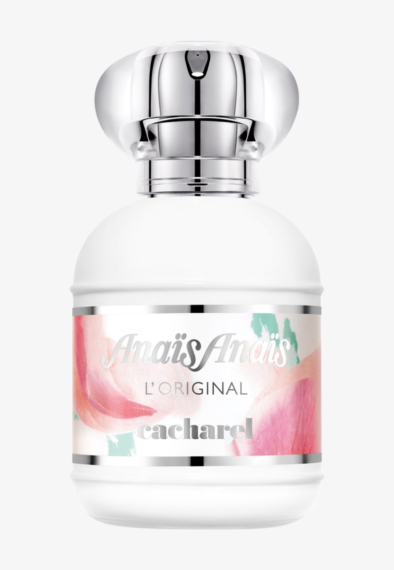 Botella de perfume blanca redondeada con tapa plateada y etiqueta floral que dice Anaïs Anaïs L'Original Cacharel.