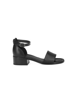 Black open-toe sandal with block heel, wide front strap, and adjustable ankle strap with silver buckle on white background.