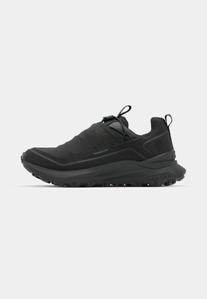 Black lightweight sneaker with textured upper, elastic laces, and rubber outsole. Features a padded collar and flexible midsole for comfort.