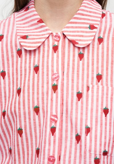 Collared shirt with vertical pink and white stripes, embroidered red strawberries, pink buttons, and a chest pocket.