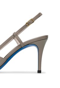 Beige patent leather high-heeled sandal with a blue accent, an adjustable strap with gold buckle, and a pointed toe.