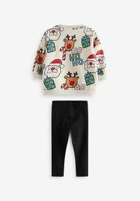 To-delt børnetøj: cremefarvet sweatshirt med rensdyr og Santa-print, samt sorte leggings. Blødt materiale, ribbede manchetter og talje.
