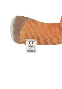 Plush toy with orange corduroy body, brown accents, and a soft gray muzzle. Includes a white care label with CE mark.