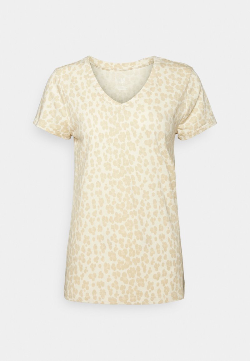 T-shirt z krótkim rękawem w odcieniu jasnego beżu z subtelnym nadrukiem w panterkę. Wykonany z miękkiego materiału, z luźnym krojem.