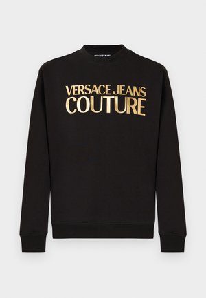 Black long-sleeve sweatshirt with ribbed cuffs and gold "VERSACE JEANS COUTURE" text printed on the chest.