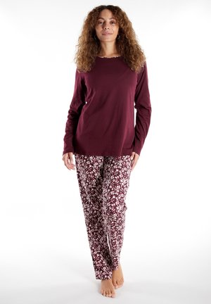 Maroon long-sleeve top with a round neckline paired with white floral-patterned pants, made of soft fabric, with a relaxed fit.