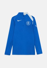 Kék, hosszú ujjú ing, fél cipzáros gallérral, Nike logóval és a bal mellkason található kör alakú Chelsea FC emblémával. Simává textúrájú anyag, kontrasztos részletekkel.