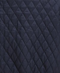 Navy quilted fabric with a diamond pattern and a smooth texture. Material appears lightweight and water-resistant. No visible hardware.