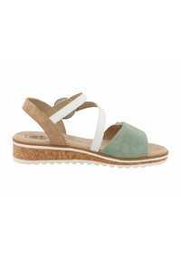 Sandals with a green suede front, tan and white cross-straps, and a cork platform sole with a textured white rubber bottom.