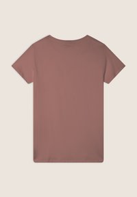 T-shirt a maniche corte e collo rotondo in un colore rosa polveroso. Tessuto morbido e liscio con una vestibilità rilassata e un retro semplice senza decorazioni.