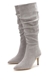 Slouchy grey suede knee-high boots with pointed toes and 3-inch heels. Smooth texture with subtle stitching details on the sides.