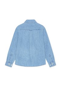 Ανοιχτό μπλε πουκάμισο από τζιν ύφασμα με μυτερό γιακά, μακριά μανίκια, μανσέτες με κουμπιά και πιέτα στην πλάτη. Διαθέτει λείο, υφασμάτινο φινίρισμα.