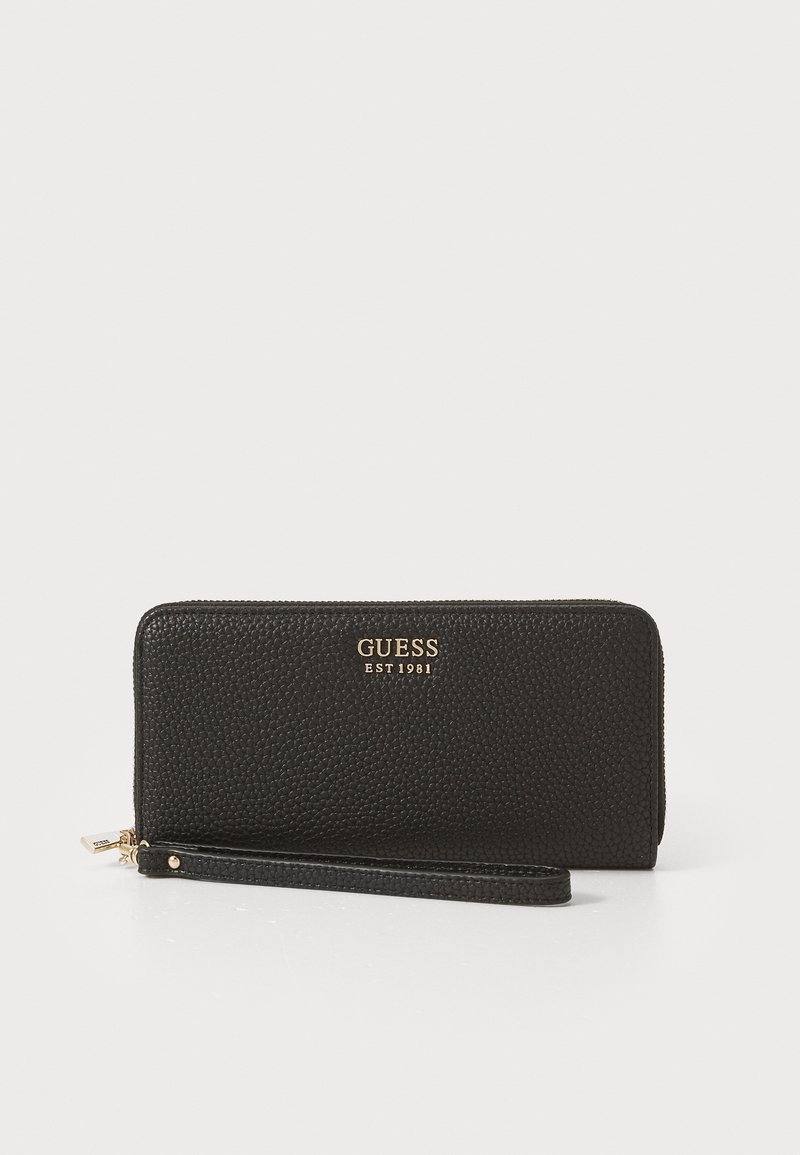Black leather wallet with textured surface, zip closure, and gold logo detailing. Includes a detachable wrist strap for convenience.