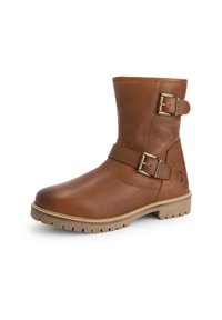 Bruine leren enkellaars met twee verstelbare messing gespen en een robuuste beige zool voor buitengebruik.