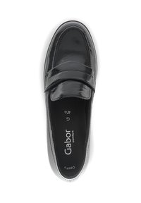 Black patent leather loafer with a smooth texture, round toe, and a decorative strap across the top. Interior features brand logo.