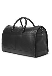Svart läder duffelväska med strukturerad yta, rund form, dubbla handtag och dragkedjestängning. Har en kontrasterande slät läderdetalj.