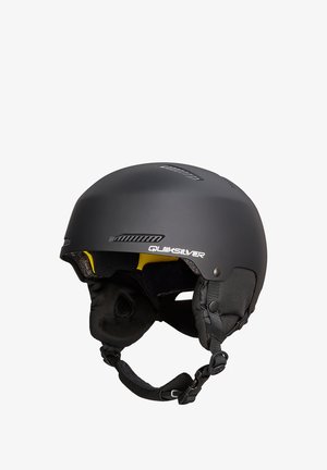 Schwarzer Snowboardhelm mit matter Oberfläche, gelbem Innenpolster und Netzseitenteilen. Verfügt über einen verstellbaren Kinnriemen und Belüftungsöffnungen.