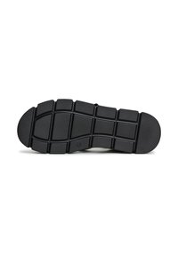 Semelle de chaussure en caoutchouc noir avec une surface texturée, présentant un motif en grille pour une adhérence et une flexibilité accrues. Design de bout arrondi.