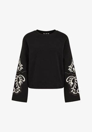 Fekete pulóver hosszú ujjakkal, fehér virágmintákkal és díszítéssel. Puha anyagból készült, cropped fazonú, raglán ujjakkal.