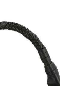 Black leather handbag handle featuring woven detailing, smooth texture, and distinct sections of stitched leather for grip.