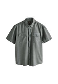 Short-sleeve shirt in a muted green fabric featuring a textured finish, button closure, and two chest pockets with flap and button accents.