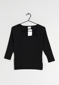 Top noir à manches longues côtelé avec un décolleté en forme de scoop, doté d'un accent nœud à l'avant. Le tissu est texturé avec une silhouette ajustée.