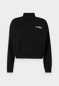 Musta lyhyt collegepaita korkealla kauluksella ja puolivetoketjulla. Koristeltu valkoisella brodeeratulla "ellesse"-logolla ja värillisellä yksityiskohdalla.