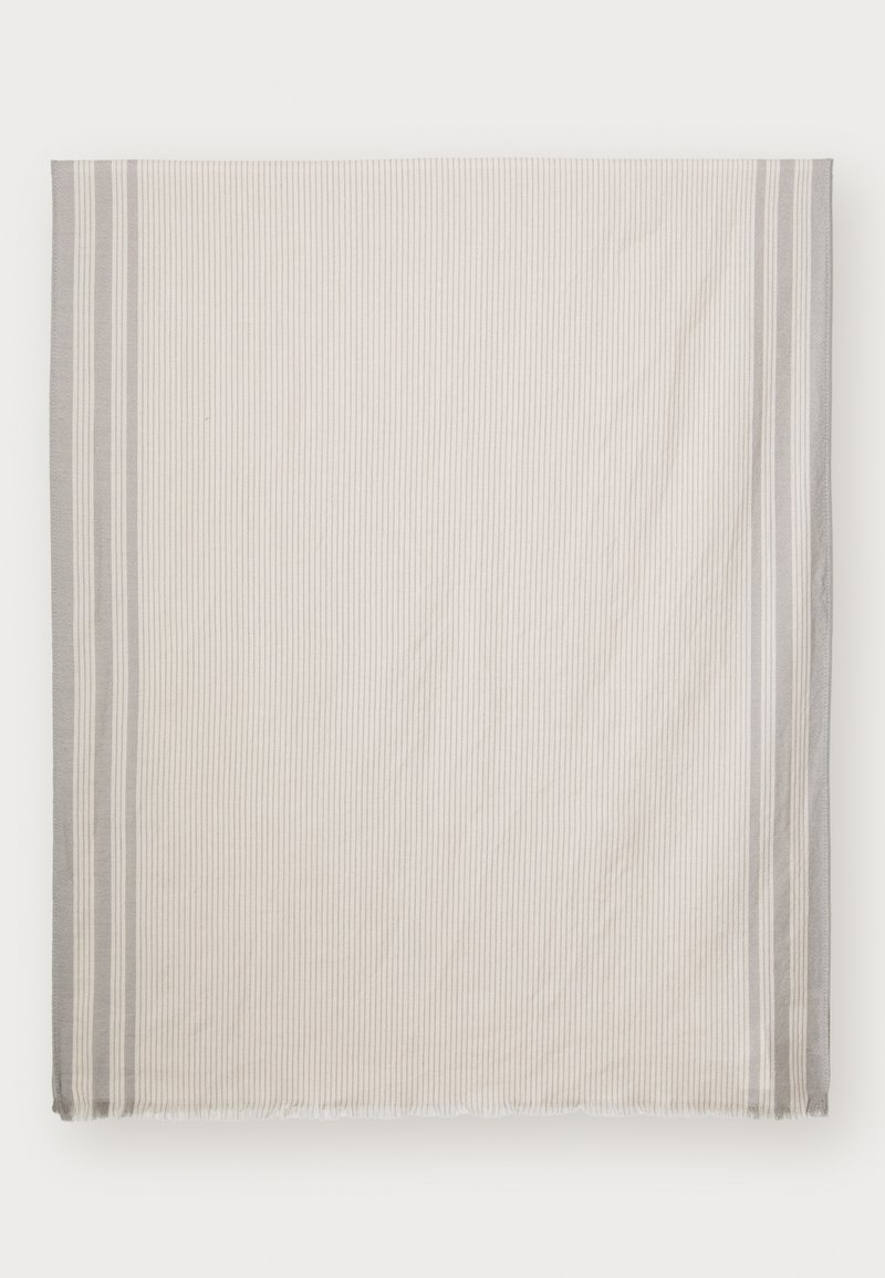 Textured cotton blanket in light cream with vertical stripes and grey accents. Finished edges with fringes. Large rectangular shape.