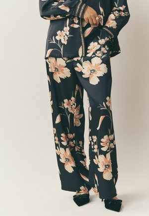 MIRA FLORAL - Stoffhose - black red
