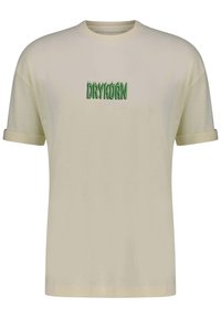 Short-sleeve beige t-shirt made of cotton, featuring a green logo "DRYKORN" in stylized lettering centered on the chest.
