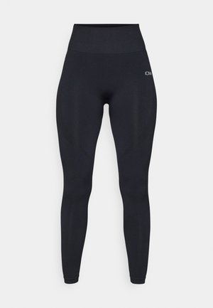 Hochtaillierte schwarze Leggings aus einem glatten, dehnbaren Stoff. Mit einem Logo am Oberschenkel und strukturierten Akzenten an den Seiten.