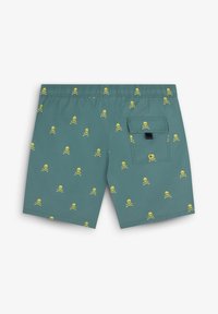 Shorts de bain pour hommes en tissu teal avec un motif de tête de mort et de os jaunes. Comprend une taille élastique et une poche au dos.