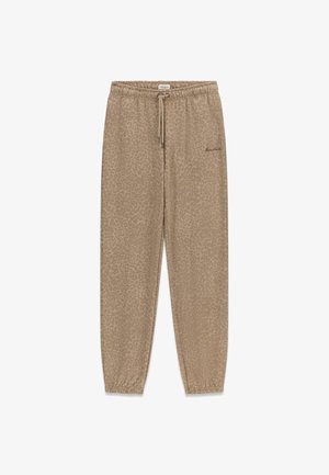 Guess Jeans, LÄSSIGE JOGGINGHOSE MIT PRINT - Pantalon de survêtement - beige