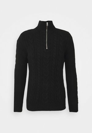 Zwarte gebreide trui met een hoge hals en een halve rits. Bevat gestructureerde kabelbreipatronen aan de voorkant en ribgebreide manchetten en zoom.