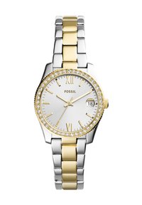 Montre-bracelet argentée et dorée avec un bracelet en métal. Boîtier rond, verre minéral et accents en cristal sur la lunette. Comprend des chiffres romains et un affichage de la date.