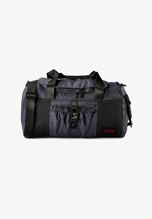 Borsa da viaggio grigio scuro con dettagli neri, materiale in nylon, due manici superiori, tracolla regolabile, tasca frontale con cerniera e tasca laterale elastica.