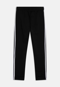 Svarta sweatpants med vita sidsremsor, tillverkade av mjukt tyg. Har en elastisk midja och en tapered design på benen.