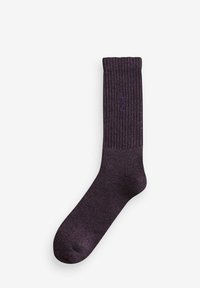 Lila gerippte Socke mit strukturiertem Finish und subtiler Logo. Verfügt über eine traditionelle Crew-Länge und eine verstärkte Zehenpartie für Langlebigkeit.
