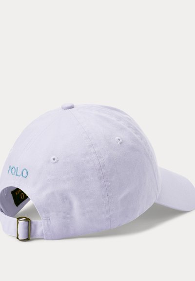 Light purple cotton baseball cap with adjustable strap, embroidered "POLO" logo in blue, six-panel design, and ventilation eyelets.