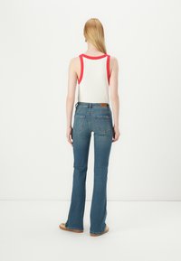 ONLY ONLWAUW MID WAIST FLARED - Flared jeans - medium blue denim
