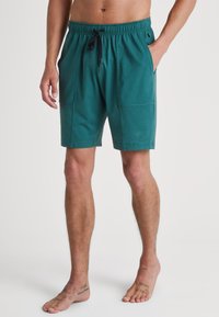Turquoise shorts van zachte stof, met een elastische tailleband met trekkoord, twee zijzakken en een relaxte pasvorm.