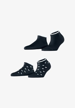 Zwei Paar schwarze Knöchelsocken mit weißem Besatz, eines schlicht und eines mit kleinen weißen abstrakten Formen verteilt.