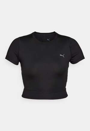 Svart kortermet crop top laget av glatt, elastisk materiale, med en subtil logo på brystet og en tettsittende design.