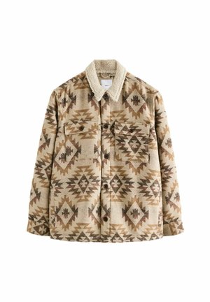 Plaid jacket in beige and brown with a textured finish. Features a Sherpa collar, two chest pockets, and button front. Geometric patterns throughout.