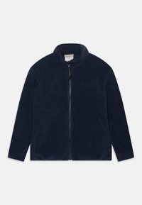 Veste en polaire bleu marine avec un col haut, fermeture éclair sur toute la longueur, deux poches latérales et un logo discret sur la poitrine gauche.