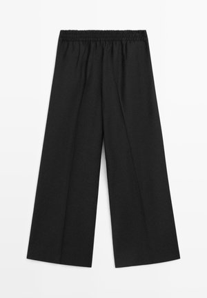Black wide-leg pants with a smooth texture and elastic waistband. Features a loose-cut design for comfort and versatility.
