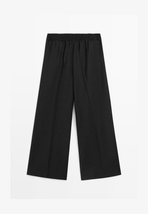 Black wide-leg pants with a smooth texture and elastic waistband. Features a loose-cut design for comfort and versatility.